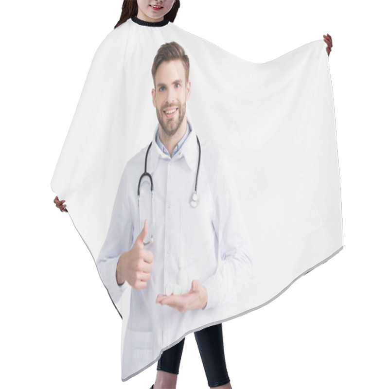 Personality  Front View Of Smiling Ophthalmologist With Thumb Up, Holding Lenses Container And Plastic Bottle Isolated On White Hair Cutting Cape