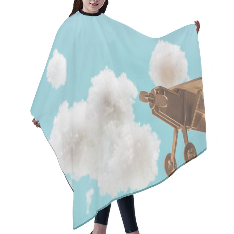 Personality  Wooden Toy Plane Flying Among White Fluffy Clouds Made Of Cotton Wool Isolated On Blue Hair Cutting Cape