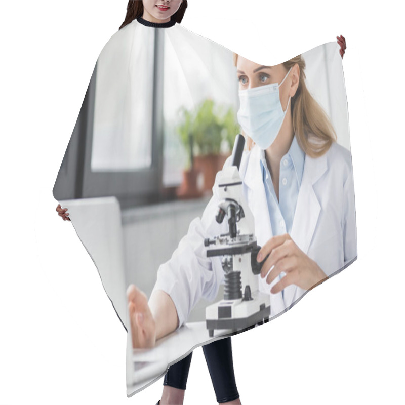 Personality  Specialist In Medical Mask Using Laptop Near Microscope On Desk  Hair Cutting Cape