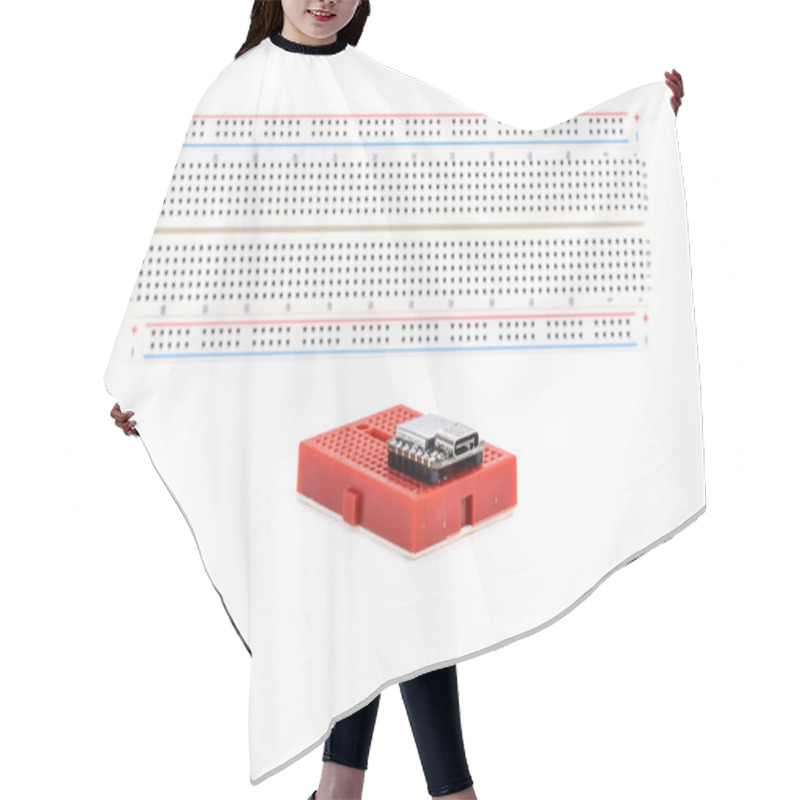 Personality  Small Red Electronic Breadboard And A Computer Controller Chip Isolated On White Background Hair Cutting Cape