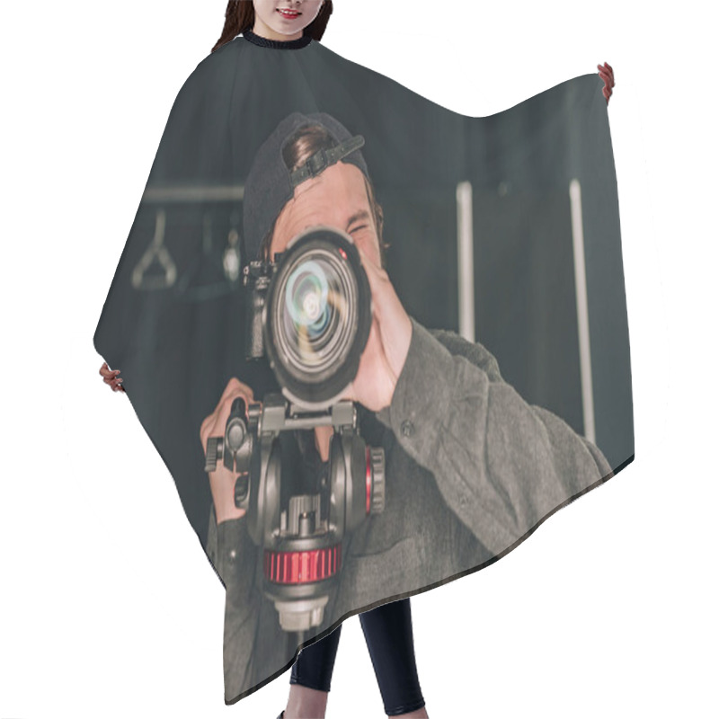 Personality  Videographer Looking Through Camera While Working In Photo Studio Hair Cutting Cape