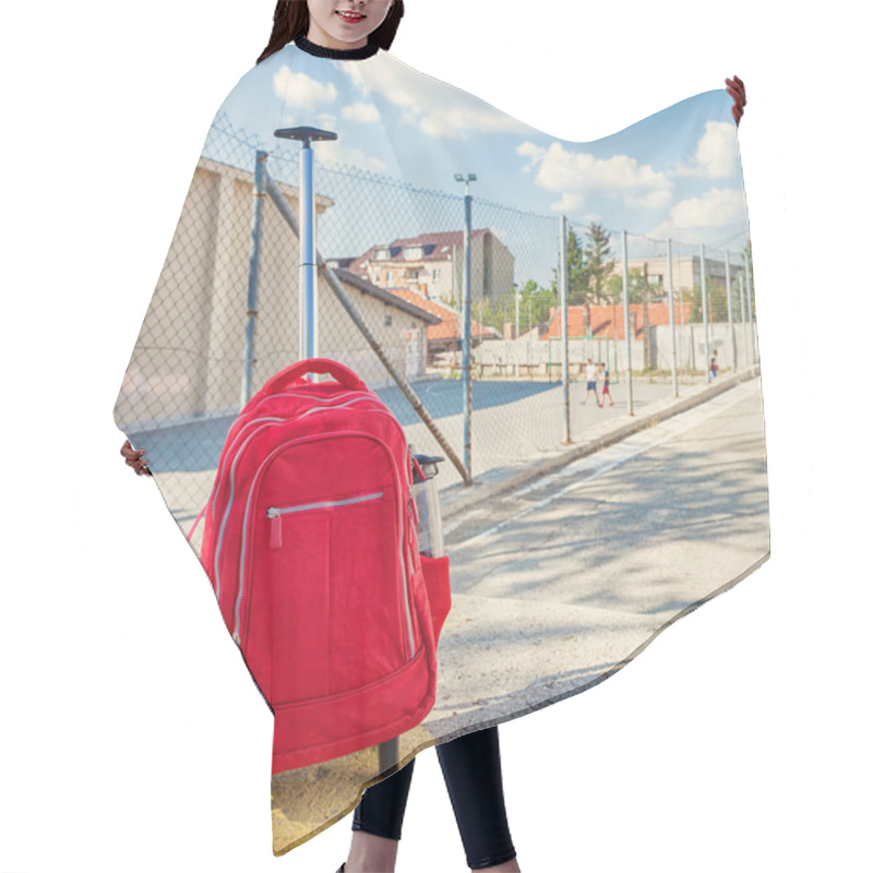 Personality  Modern Red Weightless School Bag With Handle And Wheels On The Schoolyard Hair Cutting Cape