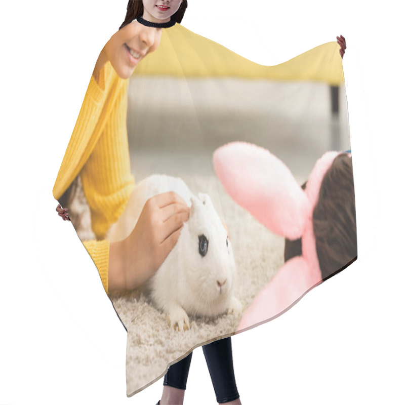 Personality  Cropped View Of Children Lying On Floor Near White Funny Rabbit Hair Cutting Cape