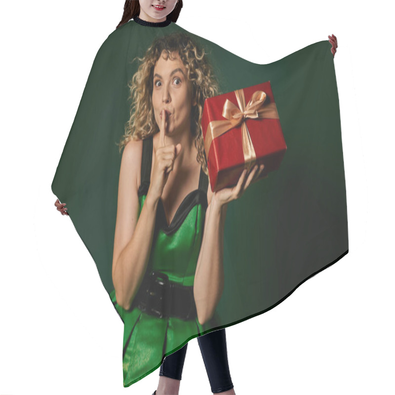 Personality  Pretty Elf Posing In Green Dress With Present In Hands On Green Backdrop Showing Silence Gesture Hair Cutting Cape