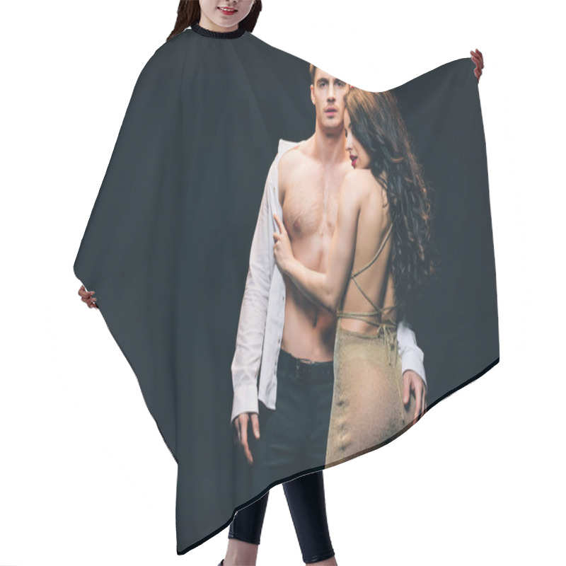 Personality  Sexy Brunette Woman Undressing Boyfriend With Muscular Torso Isolated On Black With Copy Space Hair Cutting Cape