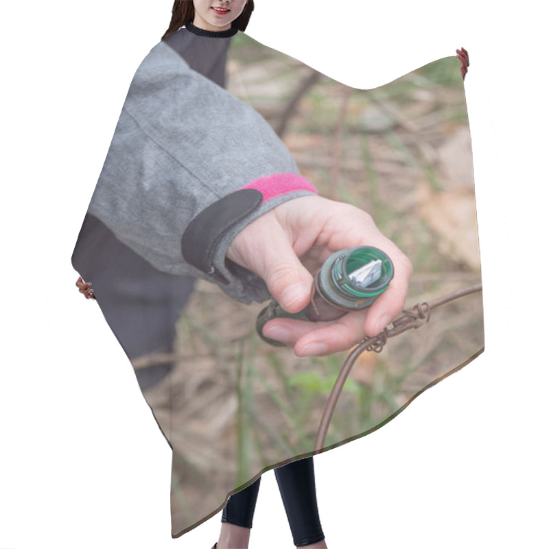 Personality  Geocaching Container In Hand. Woman  Removes List From Locating Ampoule For Geocatching  Game. Hair Cutting Cape