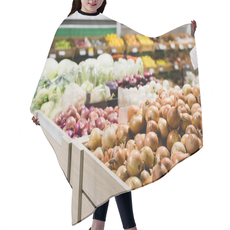 Personality  Fresh Onions And Vegetables On Blurred Background In Supermarket  Hair Cutting Cape