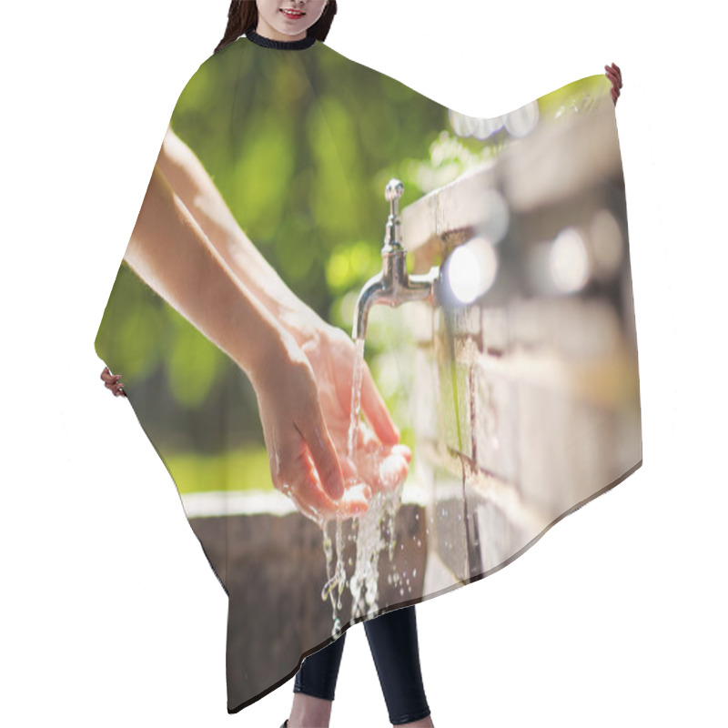 Personality  Woman Washing Hands In A City Fountain  Hair Cutting Cape