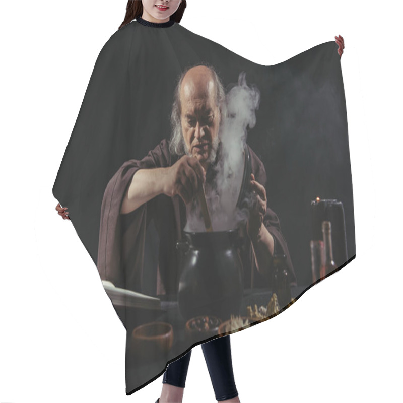 Personality  Senior Wizard Mixing Boiling Potion In Steaming Pot At Night Isolated On Black Hair Cutting Cape