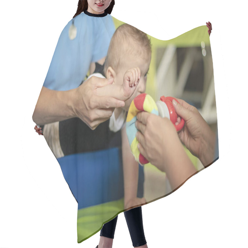 Personality  Portrait Of A Baby With Cerebral Palsy On Physiotherapy  Hair Cutting Cape