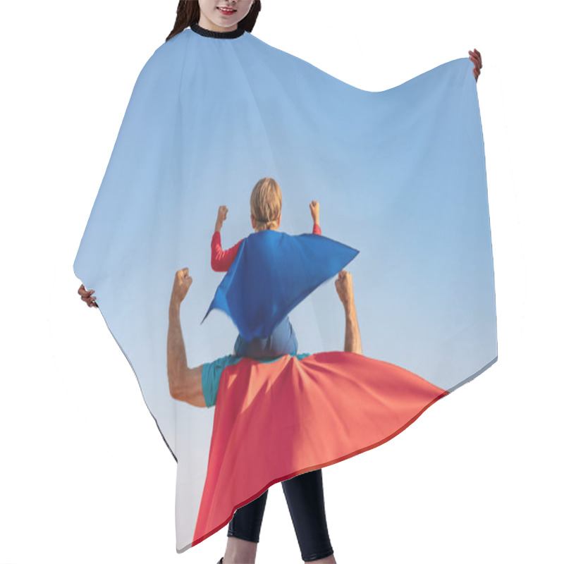 Personality  Superhero Senior Man And Child Playing Outdoor. Super Hero Grandfather And Boy Having Fun Together Against Blue Summer Sky Background. Family Holiday Concept. Happy Father's Day. Rear View Portrait Hair Cutting Cape