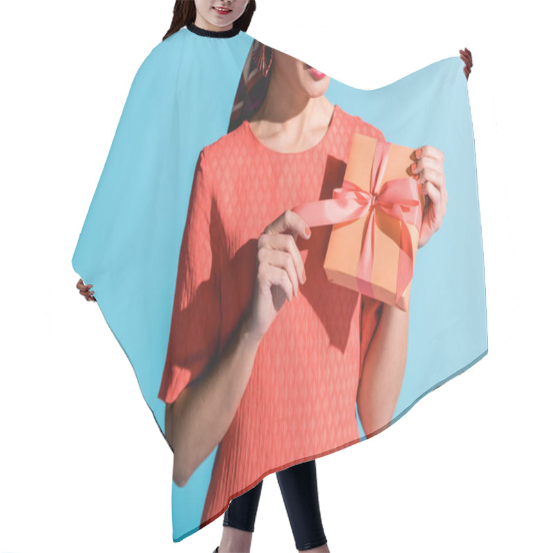 Personality  Cropped View Of Attractive Woman In Living Coral Dress Holding Gift Box Isolated On Blue Hair Cutting Cape