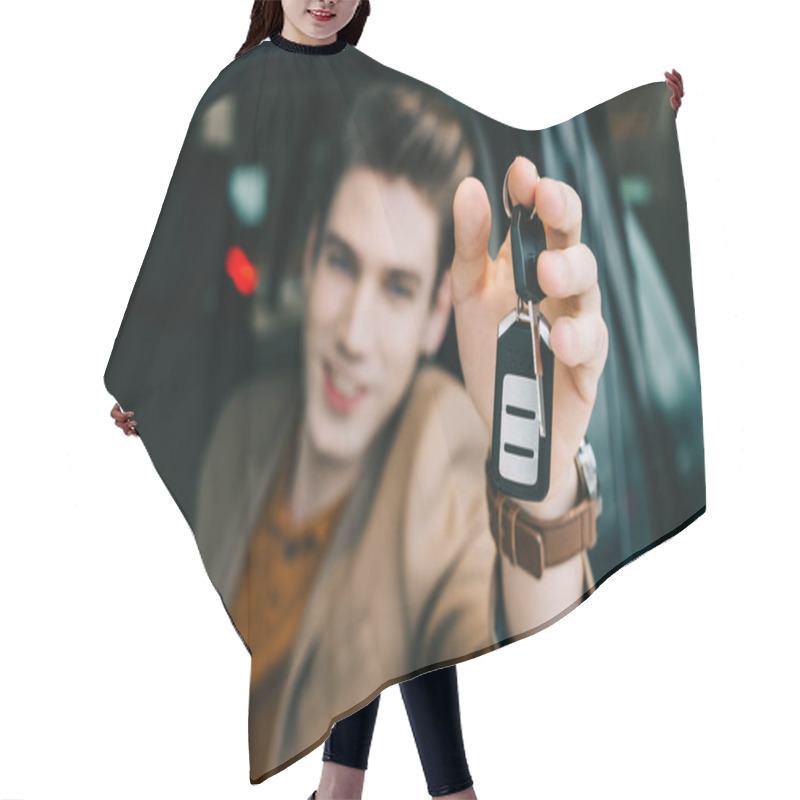 Personality  Selective Focus Of Car Key In Hand Of Happy Man  Hair Cutting Cape