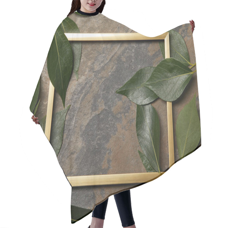 Personality  Empty Golden Frame On Stone Background With Copy Space And Green Leaves Hair Cutting Cape