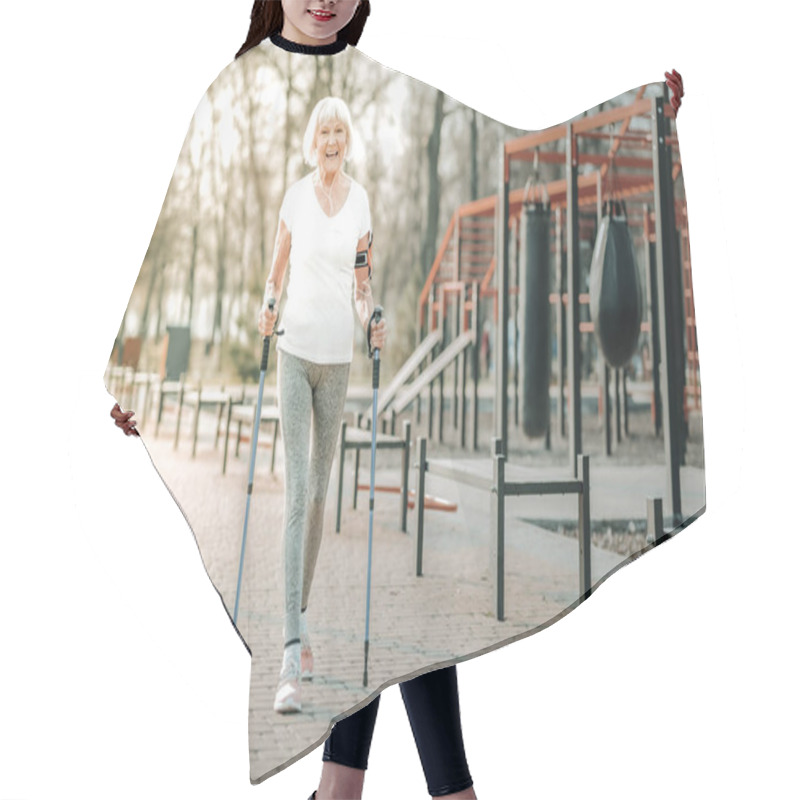 Personality  Enjoying Nordic Walking. Good-appealing Energetic Lady In The Sportswear Bursting With Laughter And Cheerfully Enjoying Nordic Walking Outdoor Hair Cutting Cape