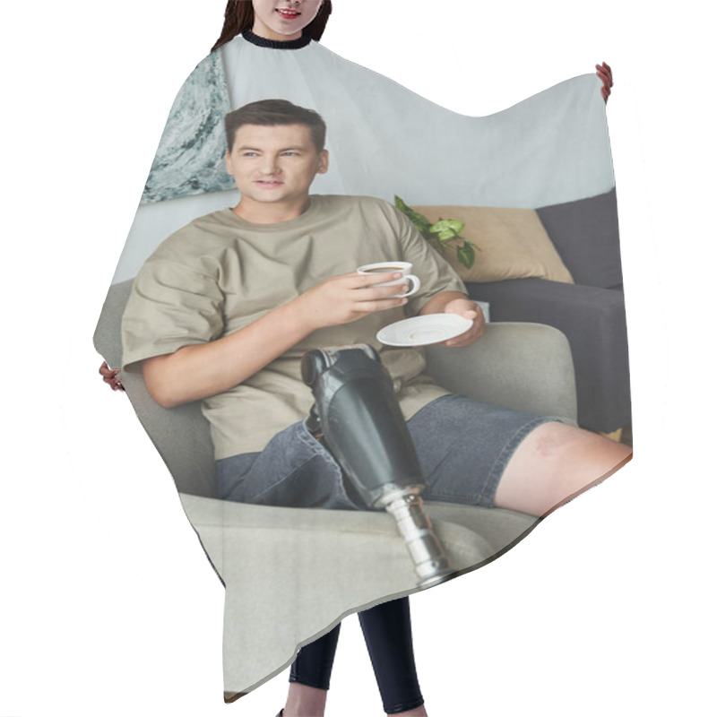 Personality  Young Man Enjoys A Coffee And Snack In A Cozy Living Area With A Prosthetic Leg. Hair Cutting Cape