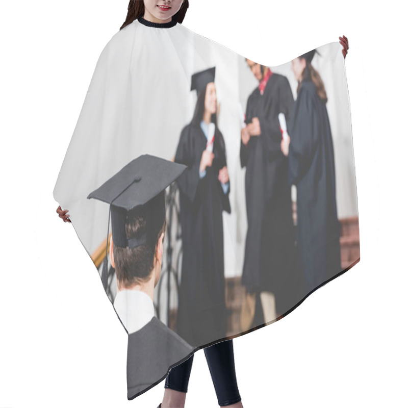 Personality  Back View Of Student In Graduation Cap Standing In University  Hair Cutting Cape