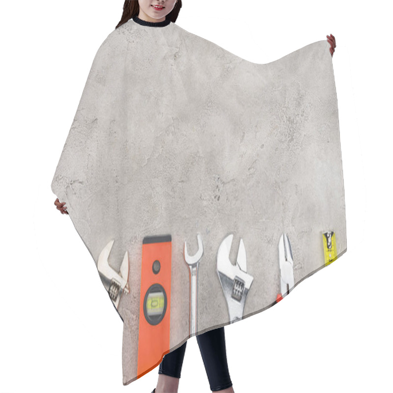 Personality  Flat Lay With Row Of Various Tools On Concrete Surface Hair Cutting Cape