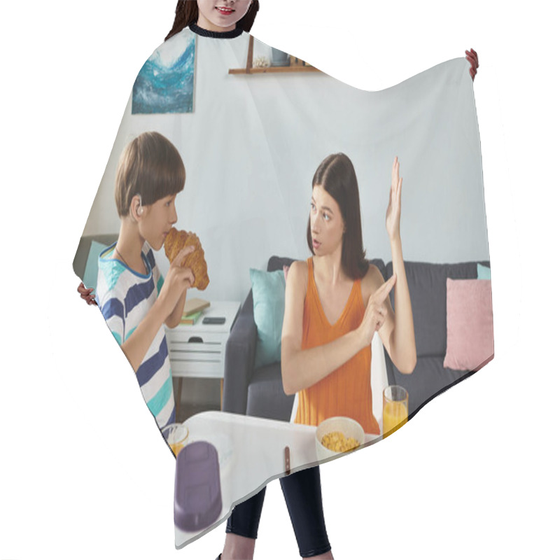 Personality  A Mother Uses Sign Language To Communicate With Her Son While Enjoying Breakfast Together. Hair Cutting Cape