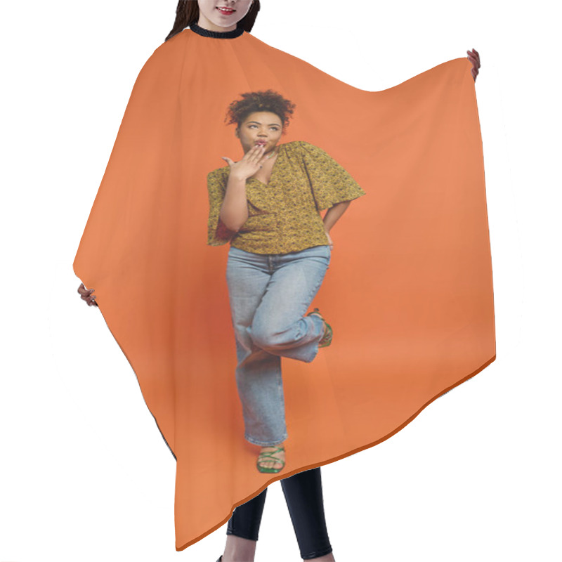 Personality  Stylish African American Woman Posing In Front Of Vibrant Orange Backdrop. Hair Cutting Cape