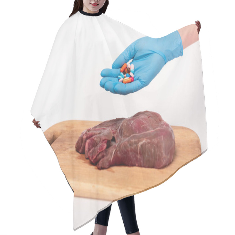 Personality  Cropped View Of Doctor Holding Hormonal Pills Near Raw Meat On Cutting Board On White Background Hair Cutting Cape