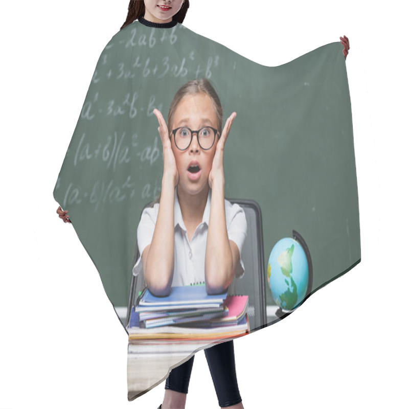 Personality  Shocked Schoolkid With Open Mouth Looking At Camera Near Notebooks And Blurred Chalkboard Hair Cutting Cape