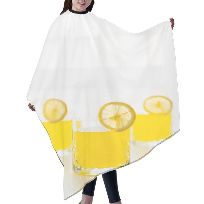 Personality  Glasses With Refreshing Citrus Tonic And Slices Of Lemon On White Background With Copy Space Hair Cutting Cape