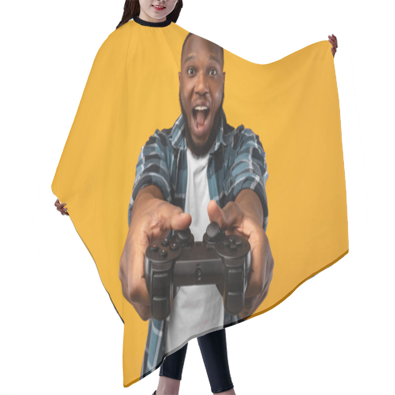 Personality  Excited Black Guy Playing Videogame Holding Game Controller In Studio Hair Cutting Cape