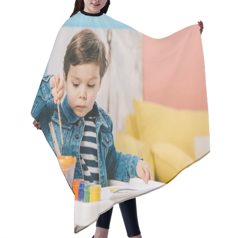 Personality  Cute Little Boy Choosing Painting Brush While Sitting On Highchair With Watercolor Paints On Table Hair Cutting Cape