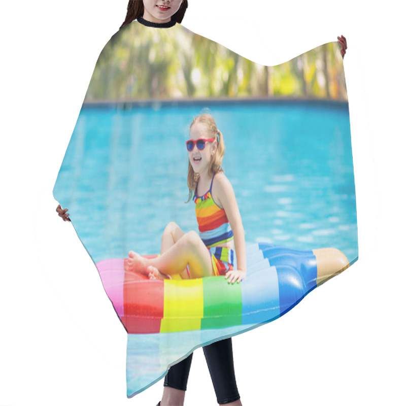 Personality  Child On Inflatable Float In Swimming Pool.  Hair Cutting Cape