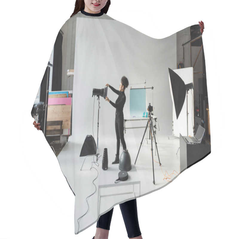 Personality  Full Length Of African American Content Producer In Black Clothes Assembling Lighting Equipment In Spacious Photo Studio Hair Cutting Cape