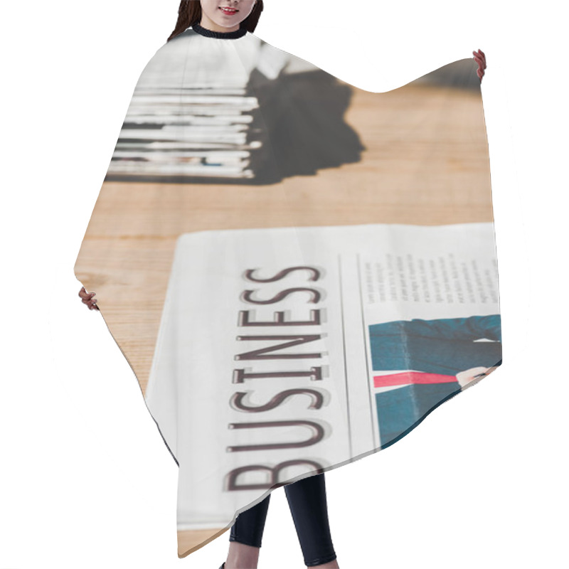 Personality  Selective Focus Of Business Print Newspaper On Wooden Table  Hair Cutting Cape