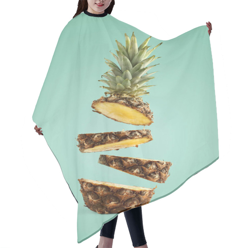 Personality  Pineapple Sliced, Levitates In The Air. Concept Of Summer Mood On A Green Background. Hair Cutting Cape