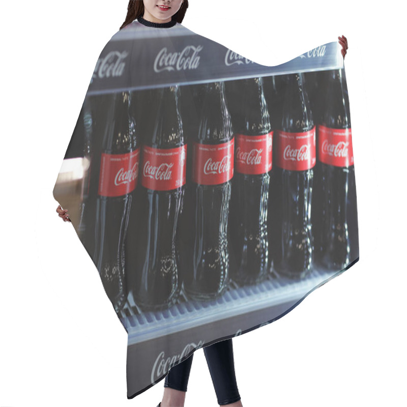 Personality  Rivne, Ukraine - 18 February 2020: Bottles Of Coca Cola Drink When In A Mini Fridge. Hair Cutting Cape