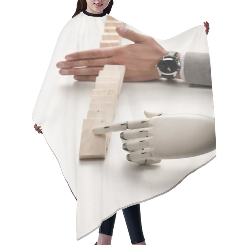 Personality  Cropped View Of Robotic Hand Pushing Wooden Bricks While Man Preventing Row From Falling Hair Cutting Cape