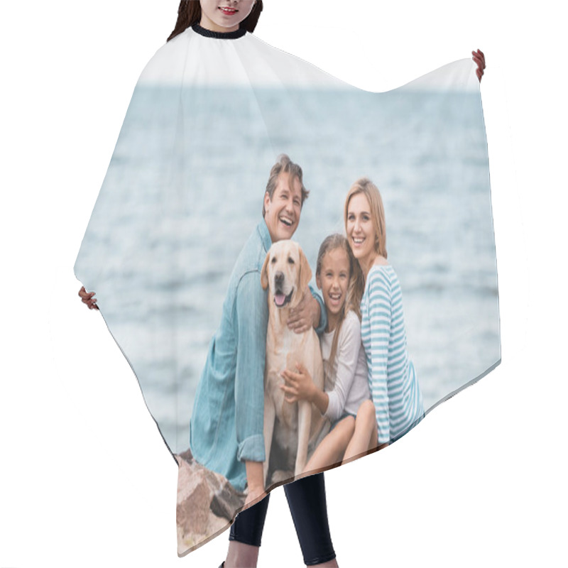 Personality  Selective Focus Of Family Looking At Camera While Petting Golden Retriever On Seaside  Hair Cutting Cape