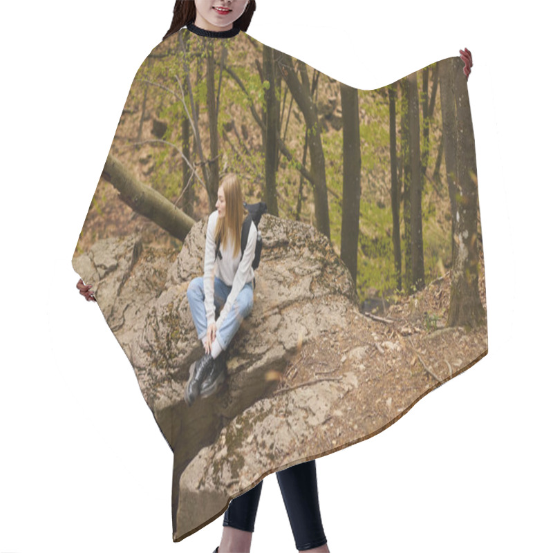 Personality  Young Woman Hiker With Backpack Sitting At Halt On Rocky Cliff In Forest Looking Away Hair Cutting Cape