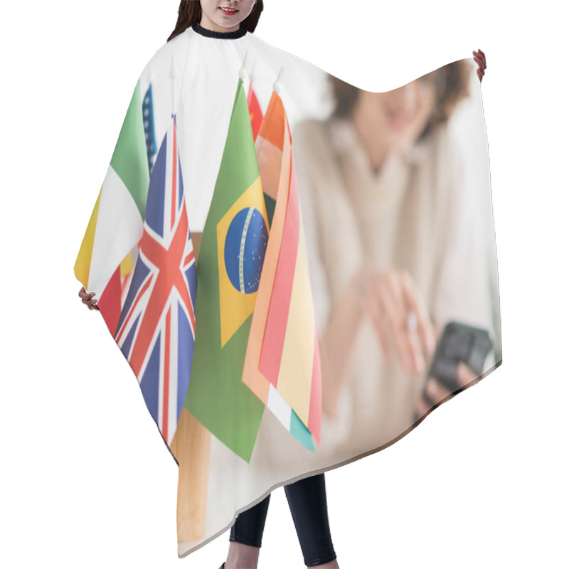 Personality  International Flags Of Different Countries Near Language Teacher On Blurred Background  Hair Cutting Cape