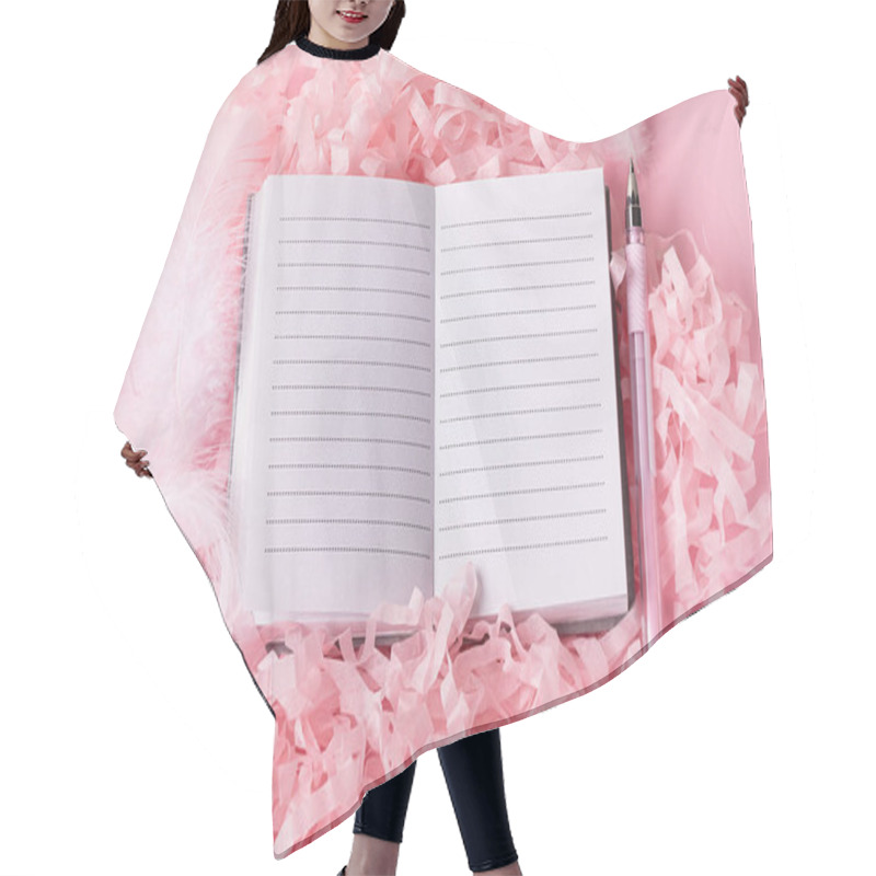 Personality  Cute Pink Fluffy Background With Open Notepad And  Pen On Decorative Paper Next To It. Top View Of On Girly Stationery And White Decorative Feathers With Ribbons Hair Cutting Cape