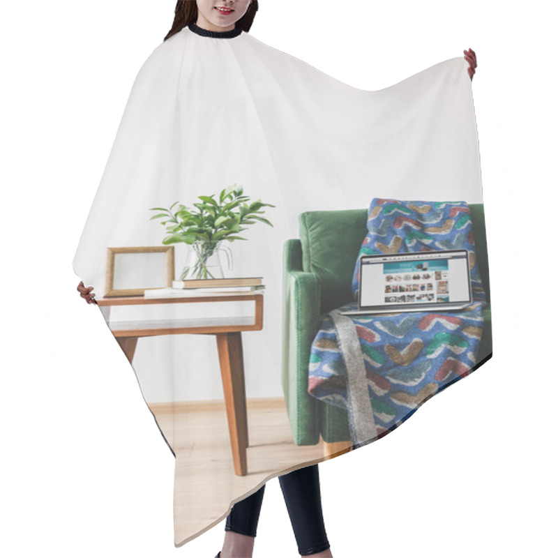 Personality  KYIV, UKRAINE - APRIL 14, 2020: Green Sofa With Blanket And Laptop With Amazon Website Near Wooden Coffee Table With Green Plant, Books And Photo Frame Hair Cutting Cape