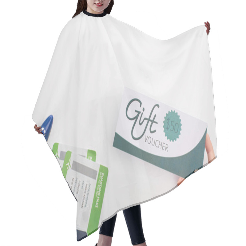 Personality  Top View Of Woman Holding Gift Voucher Near Passport With Air Tickets And Toy Airplane On White Background Hair Cutting Cape