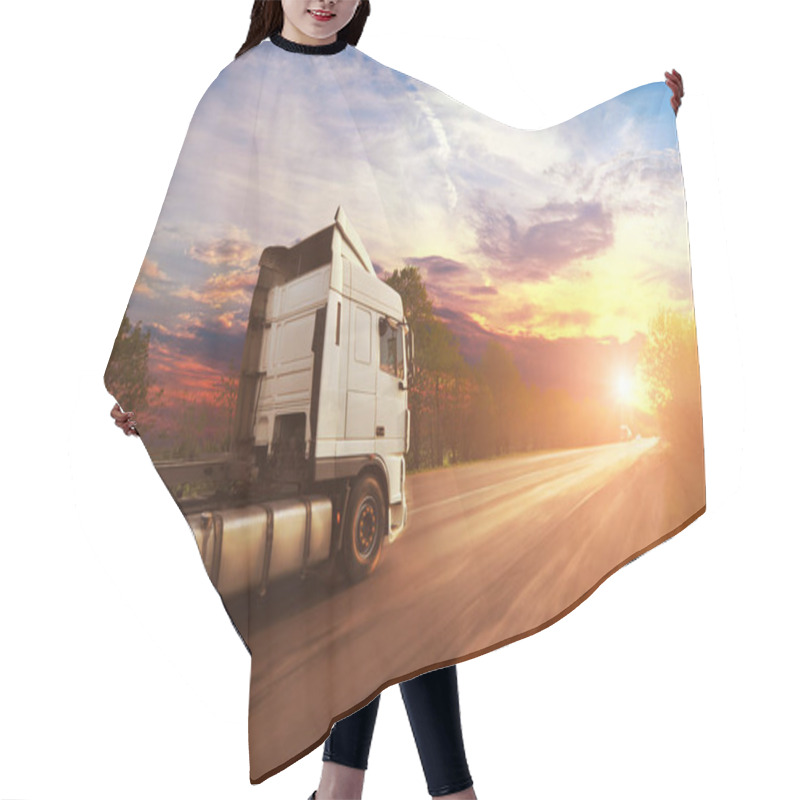 Personality  Big White Truck Driving Fast On The Countryside Road With Trees Against Bright Evening Sky With Sunset Hair Cutting Cape