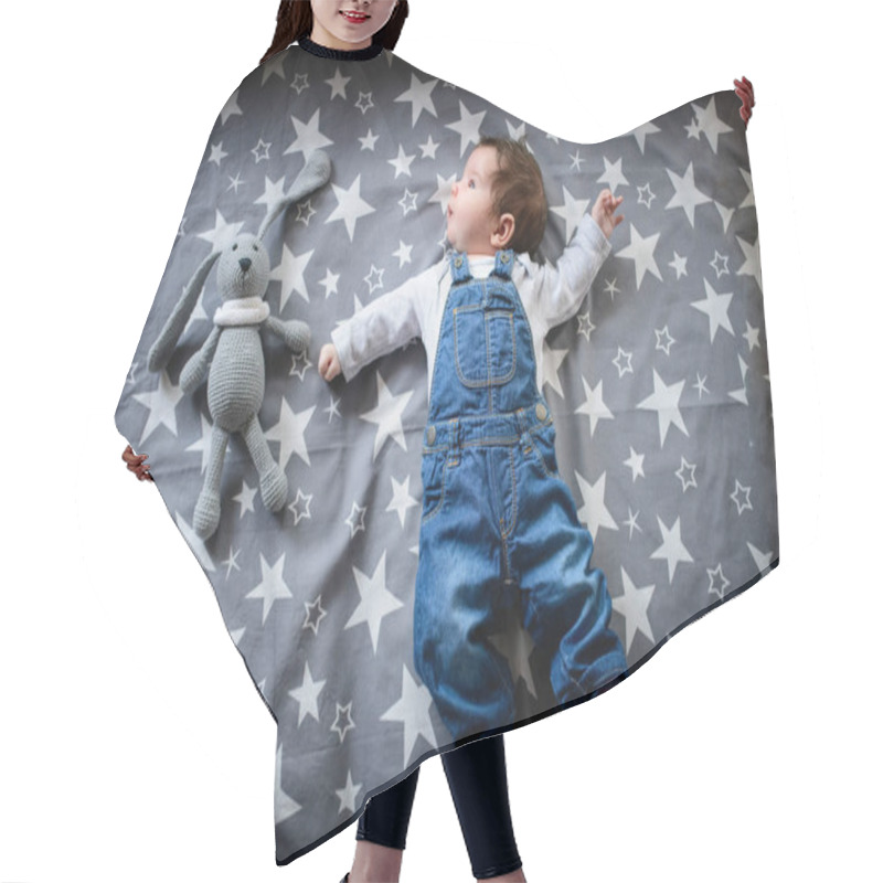 Personality  The Child Lies On A Star Blanket. Cute Newborn Baby Girl Lying In Bed. Owl Child Sleeping On A Blue Blanket With Stars. In Overalls From Jeans. Top View, Flat Lay Hair Cutting Cape