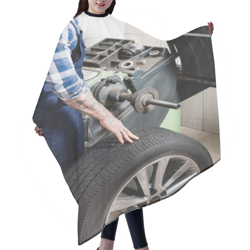 Personality  Cropped View Of Technician Checking Wheel On Balance Control Machine In Workshop Hair Cutting Cape