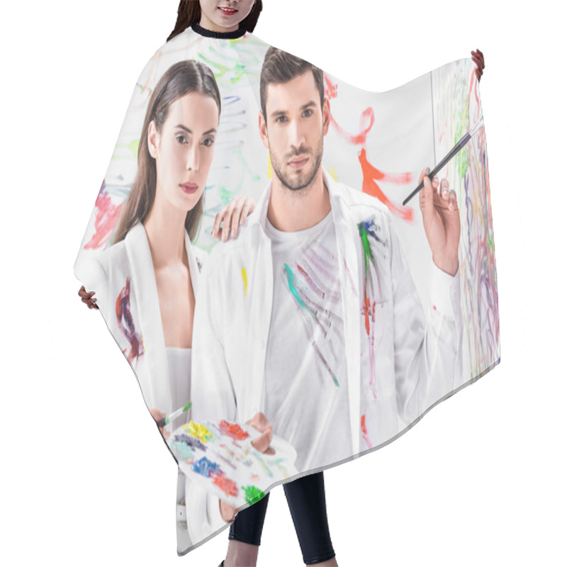 Personality  Fashion Shoot Of Couple In Total White Drawing With Paints On Wall Hair Cutting Cape