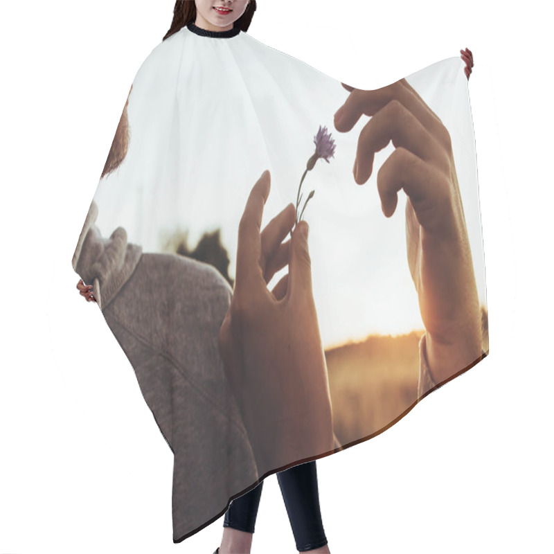 Personality  Hand Holding Cornflower At Sunset  Hair Cutting Cape