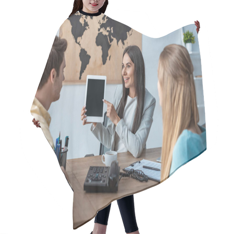 Personality  Smiling Travel Agent Pointing With Finger And Digital Tablet Near Couple Of Tourists Hair Cutting Cape