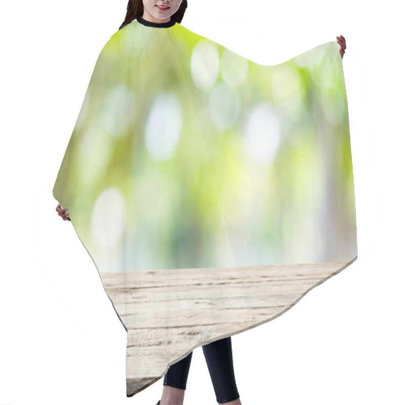 Personality  Wooden Table With Blur Background Of Nature Forest. Hair Cutting Cape