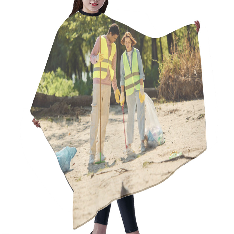 Personality  A Diverse Couple, Wearing Safety Vests And Gloves, Clean Up A Park As They Stand In The Sand Together. Hair Cutting Cape