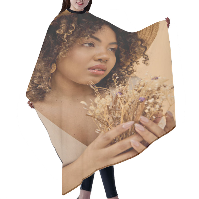 Personality  A Beautiful Young African American Woman With Curly Hair, Dressed In A Summer Dress, Holding A Bunch Of Dried Flowers. Hair Cutting Cape